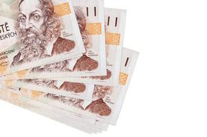 200 billets de couronne tchèque se trouvent dans un petit groupe ou un paquet isolé sur blanc. maquette avec espace de copie. commerce et change photo
