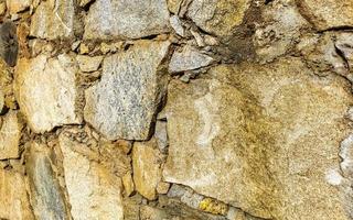 modèle de texture de mur de pierre et de brique brute puerto escondido mexique. photo