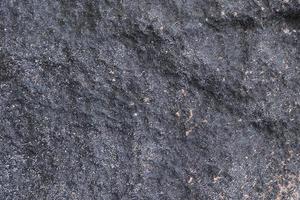 vue rapprochée sur une texture de mur de granit et de pierre en haute résolution. photo