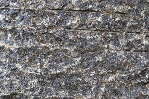 vue rapprochée sur une texture de mur de granit et de pierre en haute résolution. photo