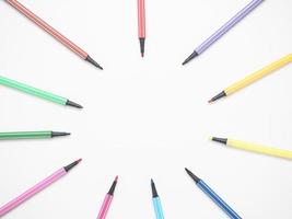 Close up color pen different array circle on white isolated top view copy space photo
