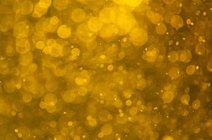élégant paillettes d'or noir foncé scintillent fond de paillettes de confettis bokeh élégant fond doré lumière jaune texture de paillettes d'or audacieuses bulle scintillante, gagnant de la pièce d'or ou chris de luxe scintillant photo