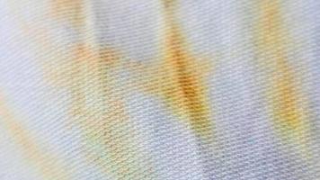 texture de tissu blanc avec des motifs jaunes et bleus en arrière-plan photo