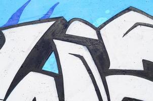 image d'arrière-plan d'un mur de béton avec un morceau de motif graffiti abstrait. art de la rue, vandalisme et loisirs des jeunes photo