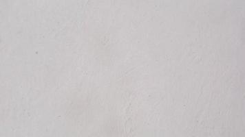 texture de mur de béton avec de la peinture blanche en arrière-plan photo