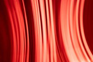 abstrait rouge chaud des rayons et de la lumière, des vagues. photo
