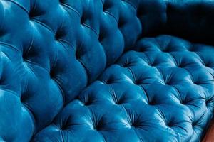texture de fond de canapé en velours avec boutons enfoncés photo
