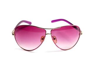 Lunettes de soleil rose isolé sur fond blanc photo