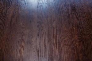 texture de grain brun bois, fond de mur sombre, vue de dessus de table en bois photo