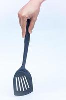 main tenant une spatule