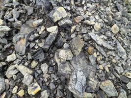 texture sale de gravier de charbon avec le sol photo