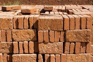 mur de briques rouges en pierre, fond de mur de briques photo