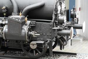 Vieux détail des roues du train à vapeur photo