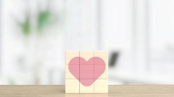 le cube en bois et le coeur rose pour la saint-valentin ou l'amour concept 3d photo