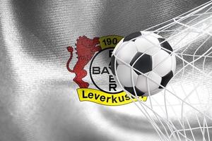 uefa champions league 2023, drapeau bayer leverkusen avec un ballon de football en filet, fond d'écran uefa, travail 3d et image 3d. erevan, arménie - 2023 janvier 27 photo