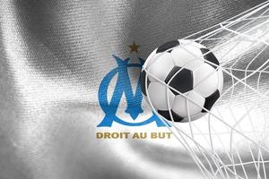 ligue des champions de l'uefa 2023, drapeau olympique de marseille avec un ballon de football en filet, fond d'écran de l'uefa, travail 3d et image 3d. erevan, arménie - 2023 janvier 27 photo