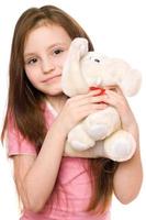 portrait de petite fille avec un éléphant en peluche photo