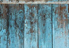 fond en bois très ancien avec de la peinture craquelée bleue photo