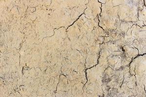 Fond de texture de l'érosion des fissures du sol au sol photo