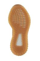 la semelle en polyuréthane de la chaussure est beige avec des rayures blanches. photo