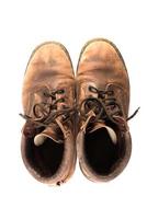 Paire de vieilles bottes marron isolé sur fond blanc