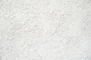 texturé de mur de plâtre en béton et fond blanc photo