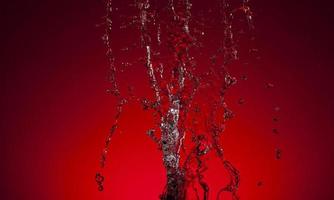 chute l'eau sur une rouge Contexte photo