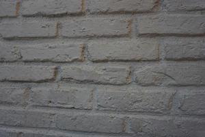 le brique mur est peint blanche. vieux brique mur. photo