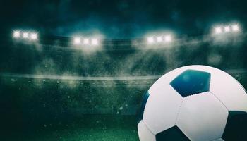 proche en haut de une football Balle à le stade pendant une nuit rencontre photo