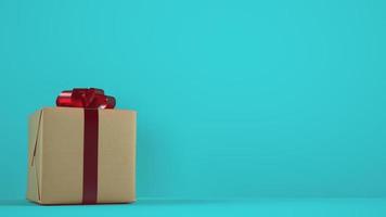 isolé Noël cadeau paquet avec rouge ruban sur cyan Contexte photo