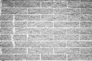 plein Cadre coup de blanc béton mur texturé et Contexte. une béton mur est une mur construit de béton blocs de uniforme taille. photo