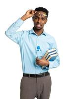 content africain américain Université étudiant permanent avec livres et bouteille de l'eau dans le sien mains sur blanc photo