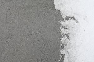 fond de mur en stuc blanc. texture de mur de ciment peint en blanc. netteté dans tout le cadre photo