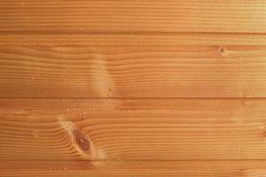 fond horizontal de planches en bois laqué marron clair. planches de bois de chêne pour murs ou sols en parquet photo