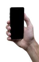 Masculin main en portant noir téléphone portable avec noir écran à isolé blanc Contexte. photo