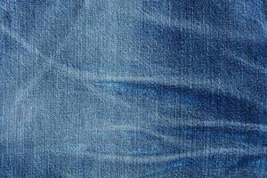 vieux bleu jeans en tissu Contexte texture. proche en haut photo