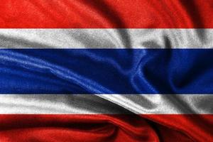 une Thaïlande drapeau soufflant dans le vent avec très détaillé en tissu texture conception photo