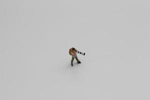 une proche en haut de une miniature figure de une photographe photo