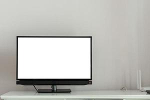 intelligent la télé écran sur blanc en bois table dans vivant pièce intérieur photo