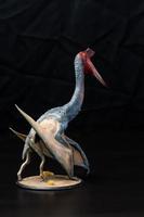 le ptérosaure dinosaure dans le foncé photo