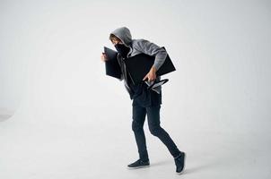 masqué homme la criminalité anonymat mise en garde cagoule lumière Contexte photo