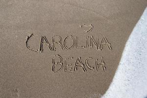 Caroline plage écrit dans le le sable photo