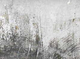 vieux grunge fissure gris béton ou ciment mur texture Contexte avec sec mousse photo