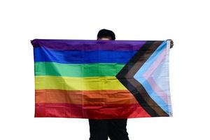 lgbt drapeau en portant dans mains avec coupure chemins, concept pour lgbt célébrations dans fierté mois, juin, autour le monde. photo