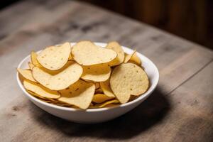 Patate frites dans une bol sur une en bois Contexte. génératif ai photo