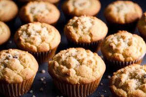 fait maison muffins avec cannelle et amandes sur une noir Contexte. génératif ai photo