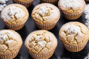 fait maison muffins avec cannelle et amandes sur une noir Contexte. génératif ai photo