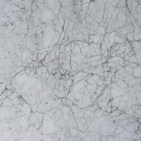 texture de pierre de marbre blanc pour le fond ou le design décoratif de carreaux de sol et de papier peint luxueux. photo