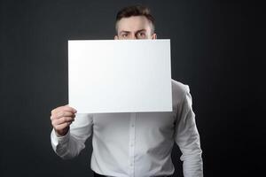 ai génératif une homme détient une Vide blanc signe planche maquette dans le sien main photo