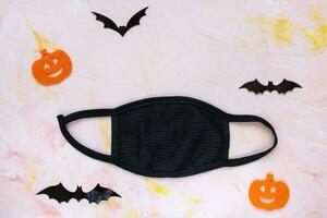 Halloween pendant COVID-19 [feminine. citrouilles, chauves-souris et masque photo